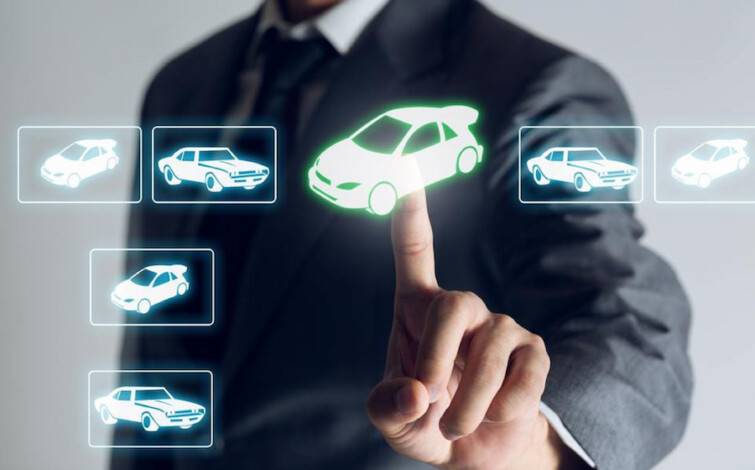 Photo of man interacting with digital interface with icons