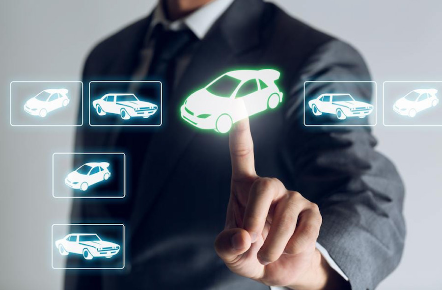 Photo of man interacting with digital interface with icons